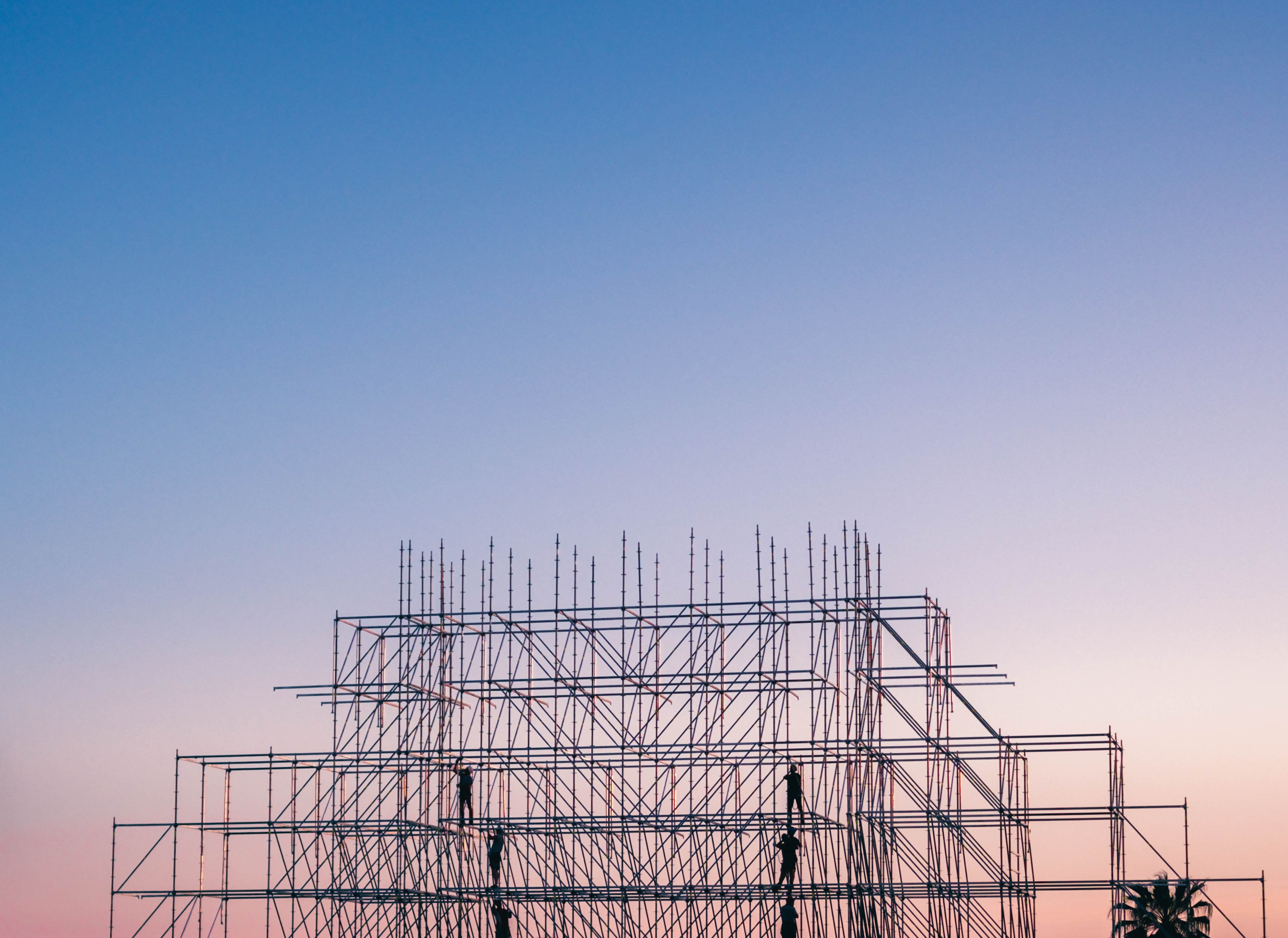 Photo-of-people-on-building-under-construction-1117452